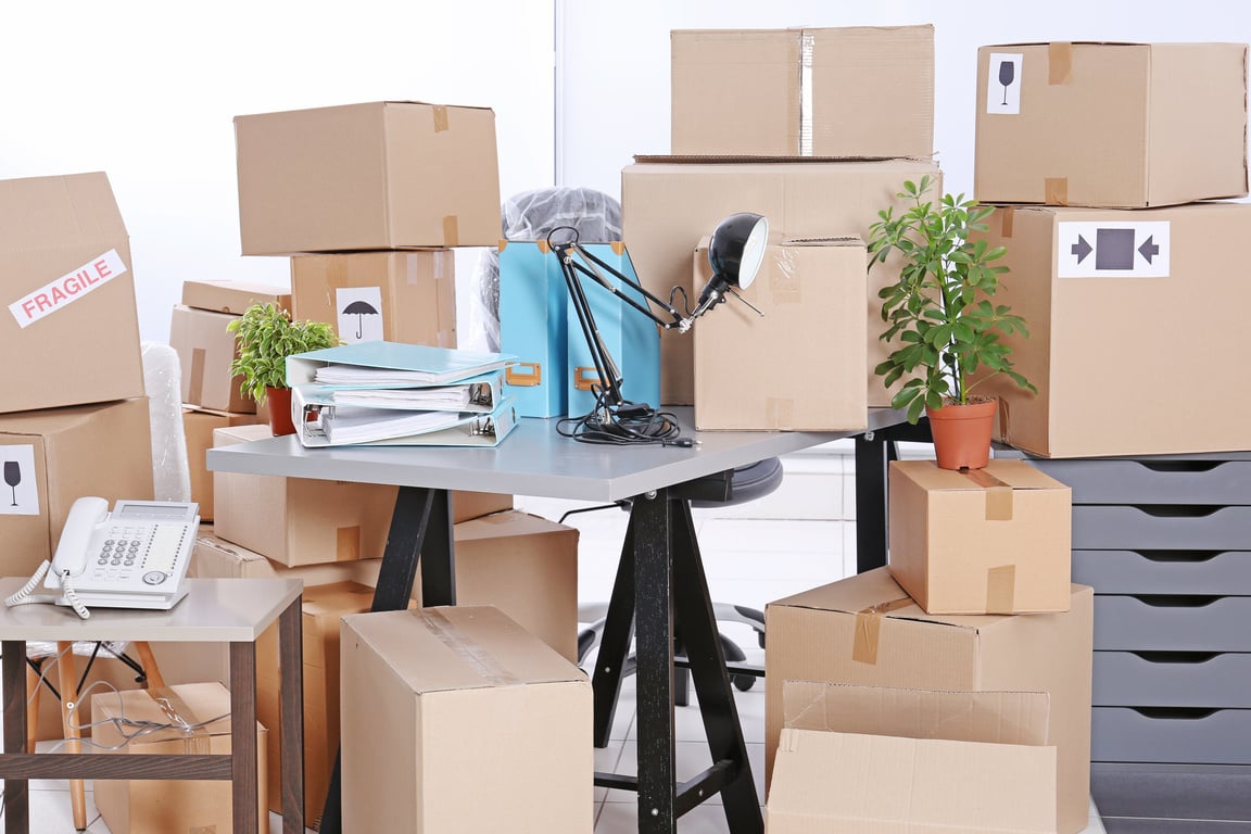 Unpacking Cardboard Boxes in a New Office